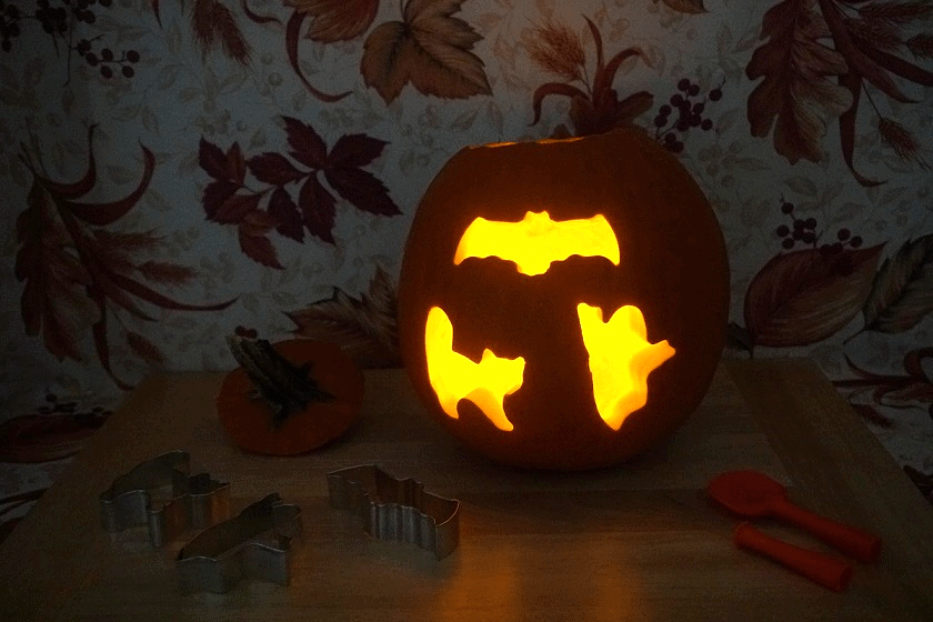 pumpkin carved with cookie cutters